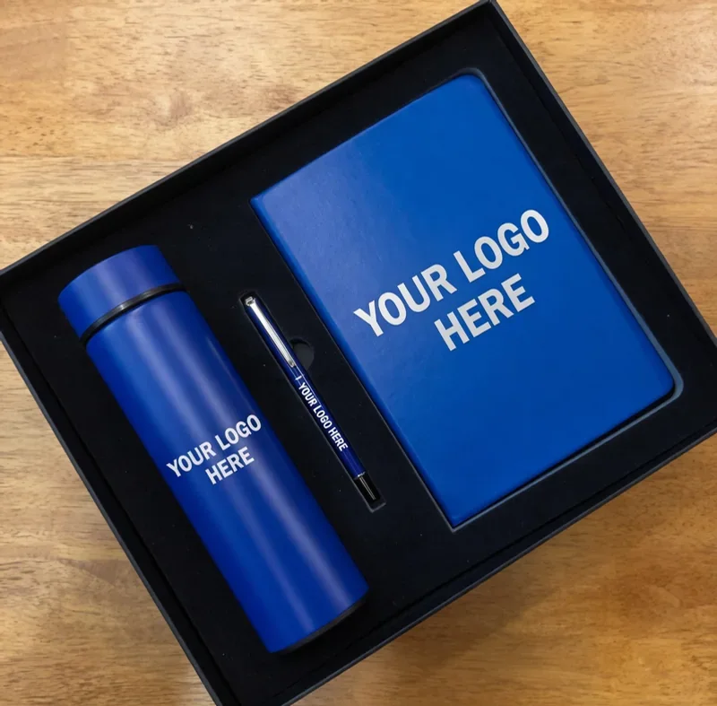Blue executive gift set with branded stationery and drinkware